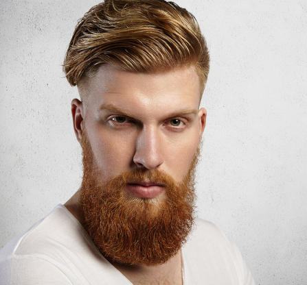 Bearded man with a full, natural beard after a successful beard transplant