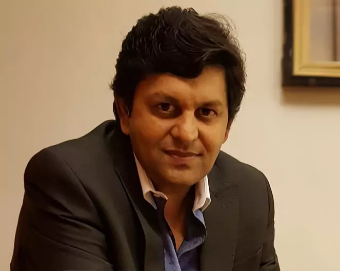 Dr. Neeraj Pandey, M.D., Medical Director (Emeritus), renowned for delivering the best hair transplant in the world using advanced techniques.